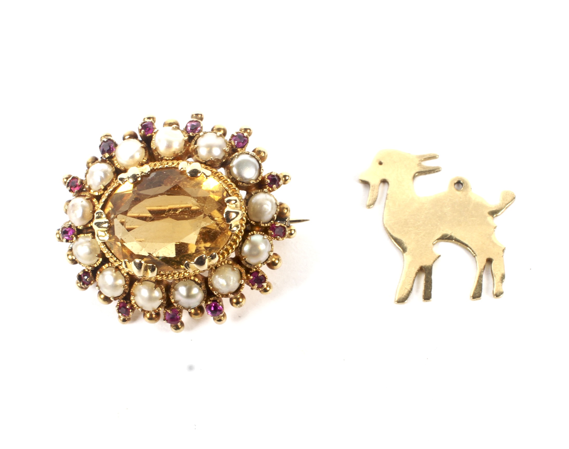 An early 20th century gold, citrine, half-pearl and ruby oval cluster adapted as a brooch.