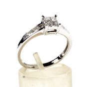 A modern 18ct white gold and princess diamond dress ring.
