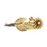 A Victorian gold and diamond 'chrysanthemum' stem brooch.