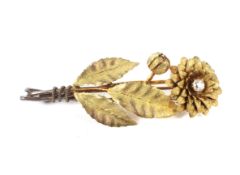 A Victorian gold and diamond 'chrysanthemum' stem brooch.