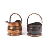 Two 19th century copper helmet shaped coal buckets. One with rear handle. H23.5cm & H19.5cm.