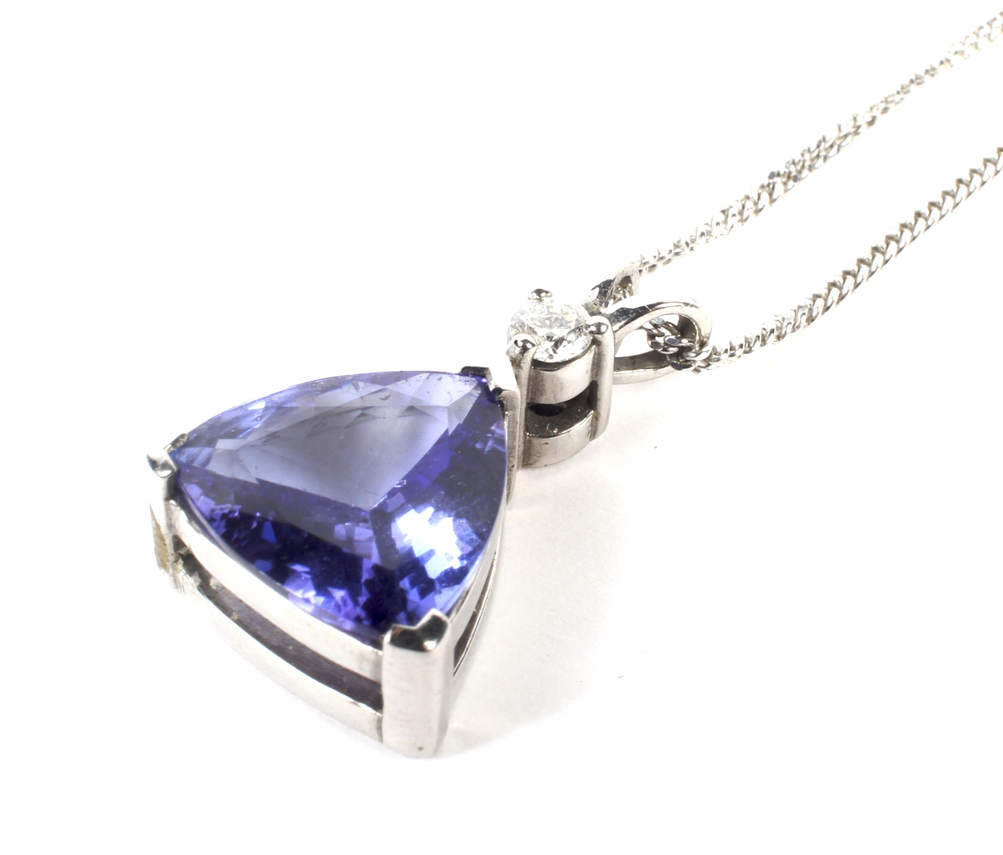 A 9ct white gold tanzanite and diamond pendant on a 9ct white gold necklace. - Image 2 of 2