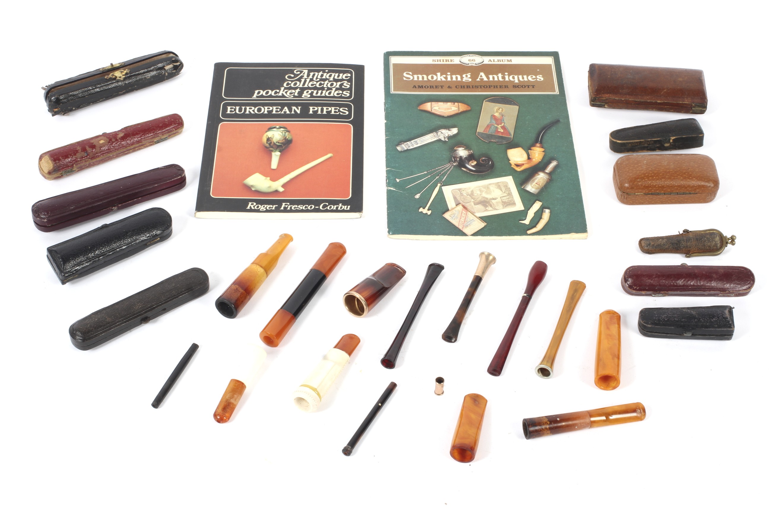 A collection of 20th century cheroot and cigarette holders in case.