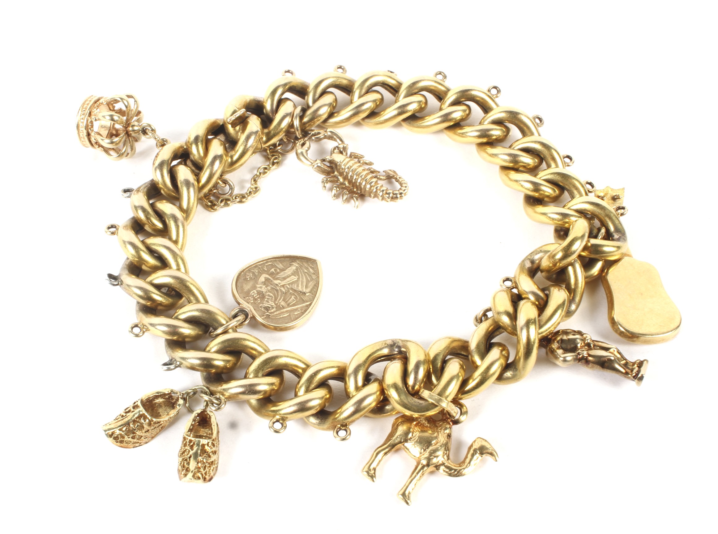 An early 20th century hollow gold charm bracelet.