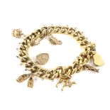 An early 20th century hollow gold charm bracelet.