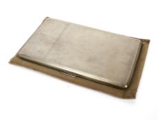 A silver gilt cigarette case with engine turned decoration.