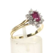 A vintage Italian 18ct gold, ruby and diamond oval cluster ring.