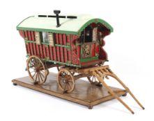 A vintage scratchbuilt model of a gypsy caravan with fitted interior.