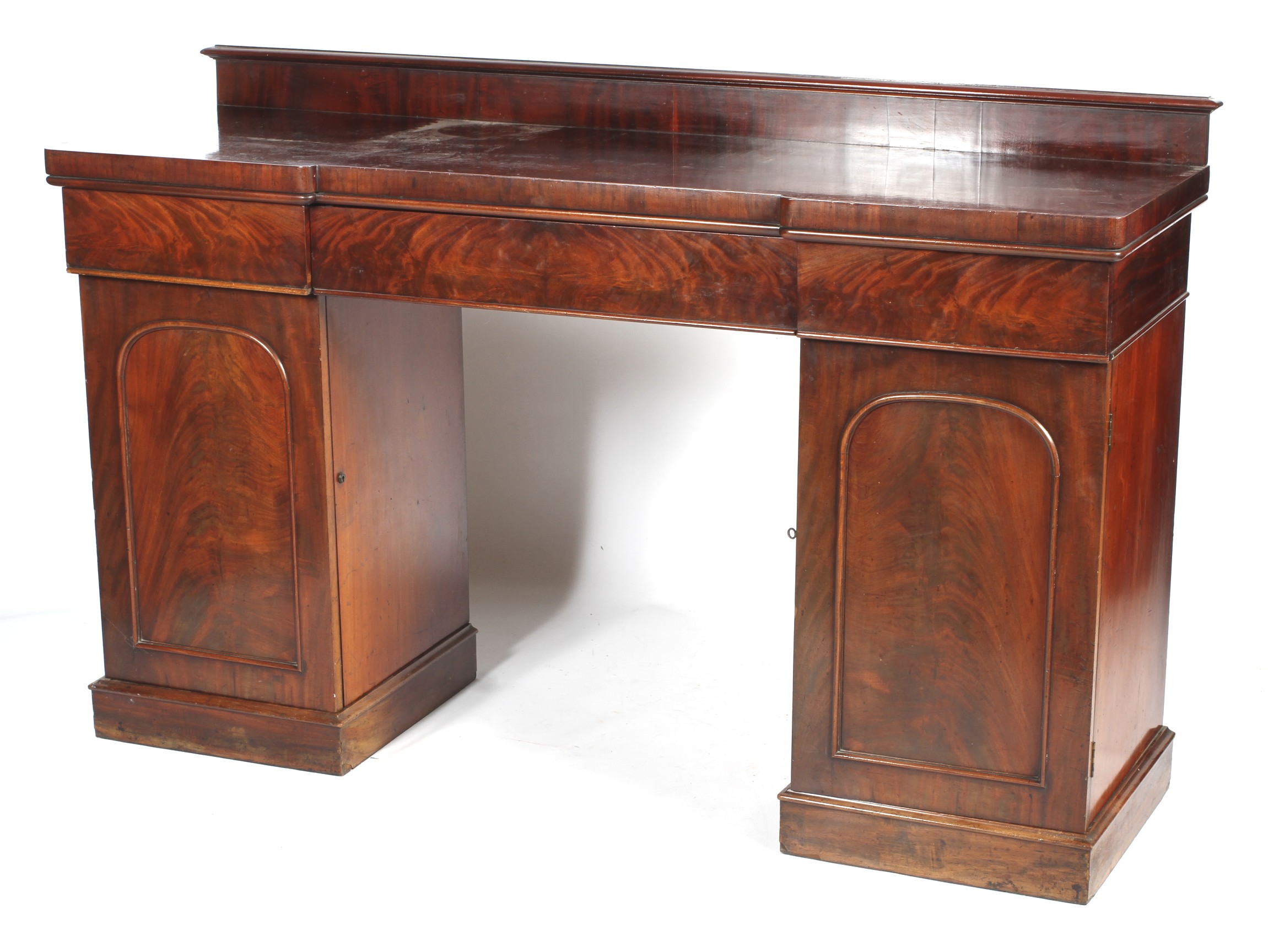 A Victorian mahogany twin pedestal breakfront sideboard.