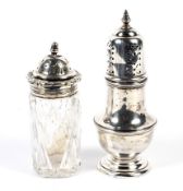 A George VI silver shaker and a silver topped glass shaker.