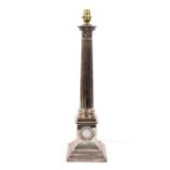 A Victorian silver Corinthian column candletick later adapted into a table lamp base.