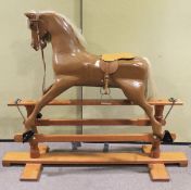 A large 20th century painted wooden rocking horse.