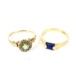 An early 20th century gold, peridot and half-pearl cluster ring and a modern lapis lazuli ring.