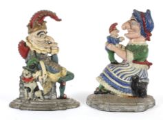 A pair of cold painted cast iron Punch and Judy door stops.