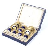 A Mappin and Webb Limoges coffee set in a silk lined case.