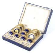 A Mappin and Webb Limoges coffee set in a silk lined case.