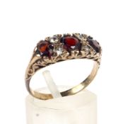 A vintage 9ct gold, garnet and paste half-hoop ring in Victorian style.