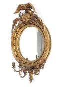 A 19th century Regency giltwood and gesso convex girondole mirror.