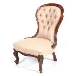 A Victorian mahogany button back chair.