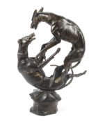 After BAYRE a 20th century large bronze study of two greyhounds fighting raised on a sculptured