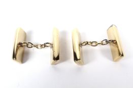 A pair of silver-gilt 'ingot' cufflinks.