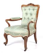 An early 20th century light oak armchair.