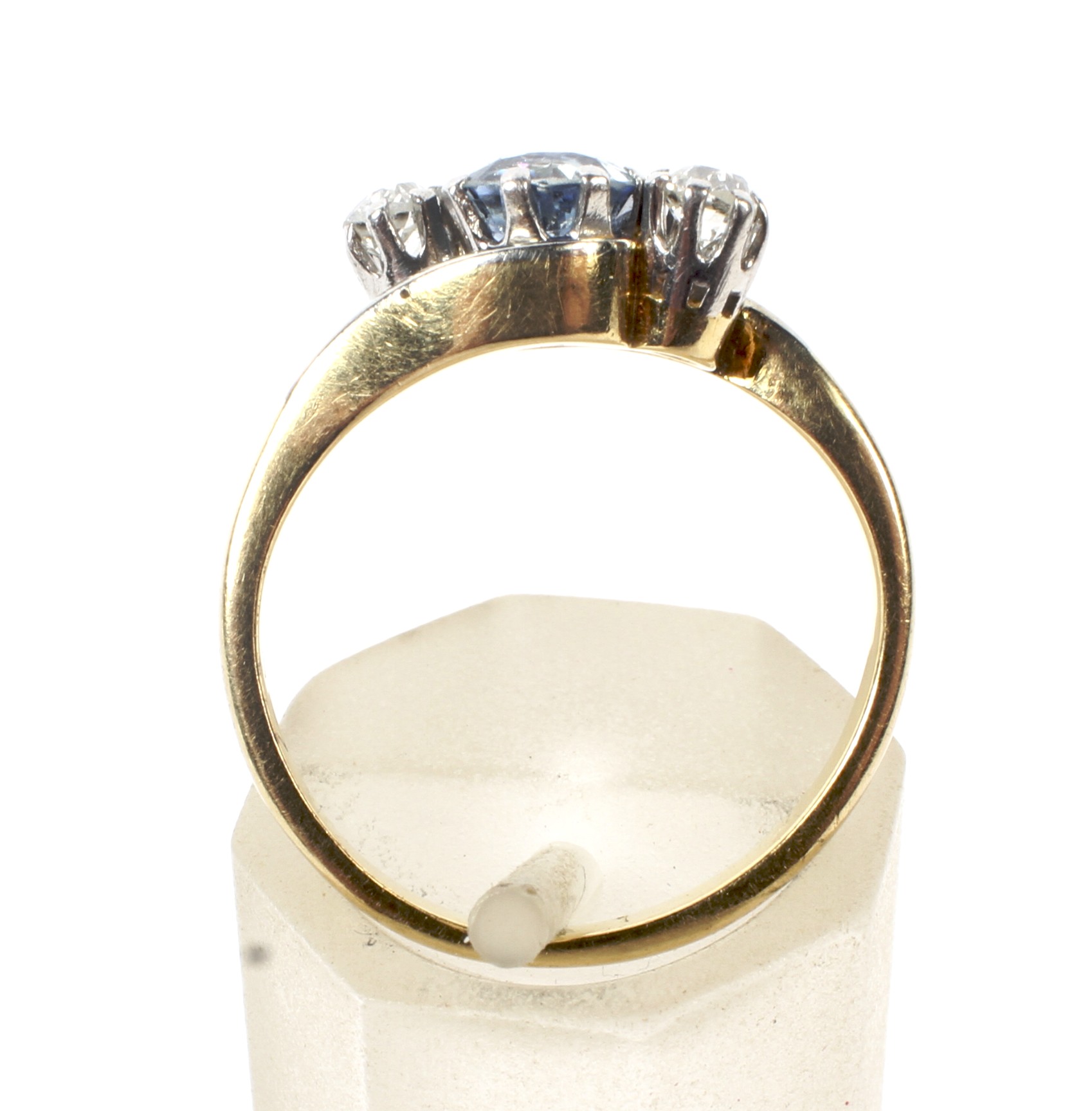 A mid 20th century gold, sapphire and diamond three stone cross-over ring. - Image 6 of 6