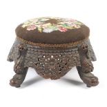 A carved hardwood Anglo-Indian low footstool.