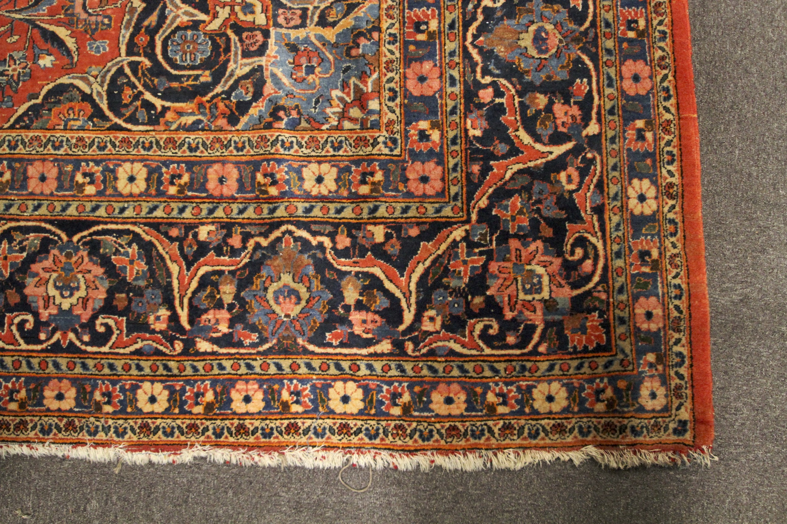 A large Persian style woollen carpet. - Image 2 of 3