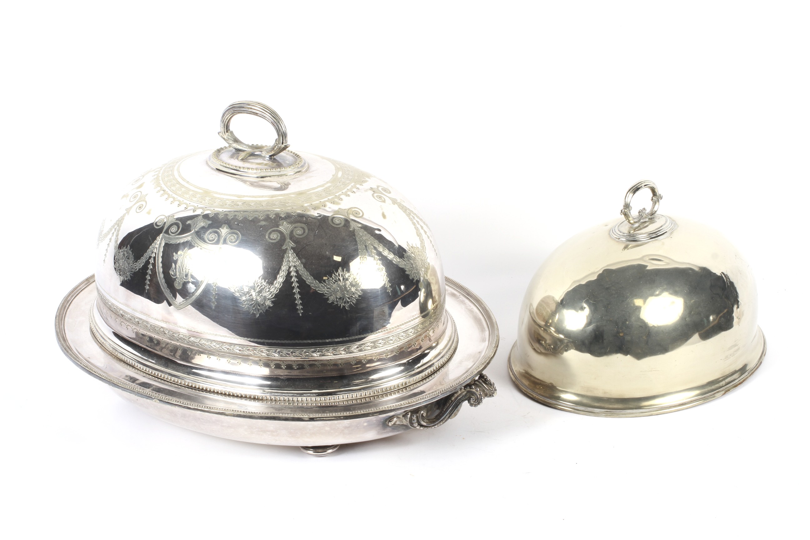 A large Edwardian silver-plated meat-dish warmer and two domed covers in sizes.