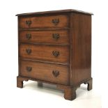 A Georgian style mahogany chest of drawers of small proportion.