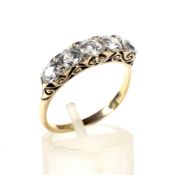 A late Victorian gold and diamond five stone carved half-hoop ring.