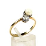 An early 20th century gold, diamond and cultured-pearl two stone ring. The old-cut diamond approx.