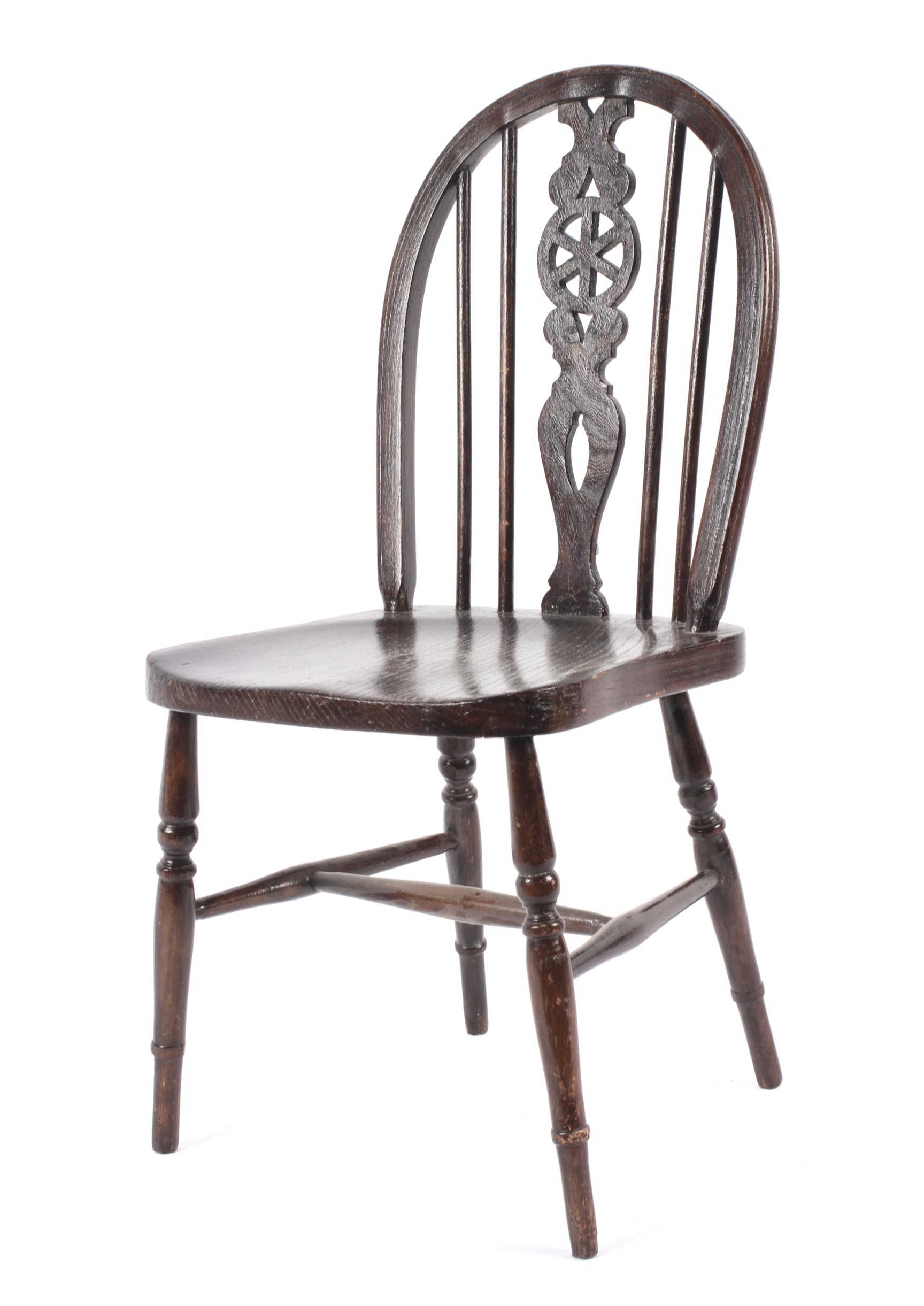 An early 20th century stained wooden apprentice piece wheel back chair.