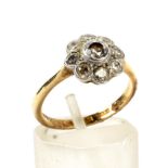 An early-mid 20th century gold and diamond 'daisy' cluster ring.