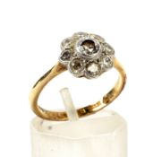 An early-mid 20th century gold and diamond 'daisy' cluster ring.