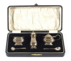 A boxed George V condiment set.
