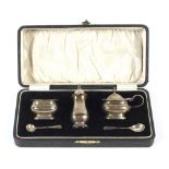 A boxed George V condiment set.