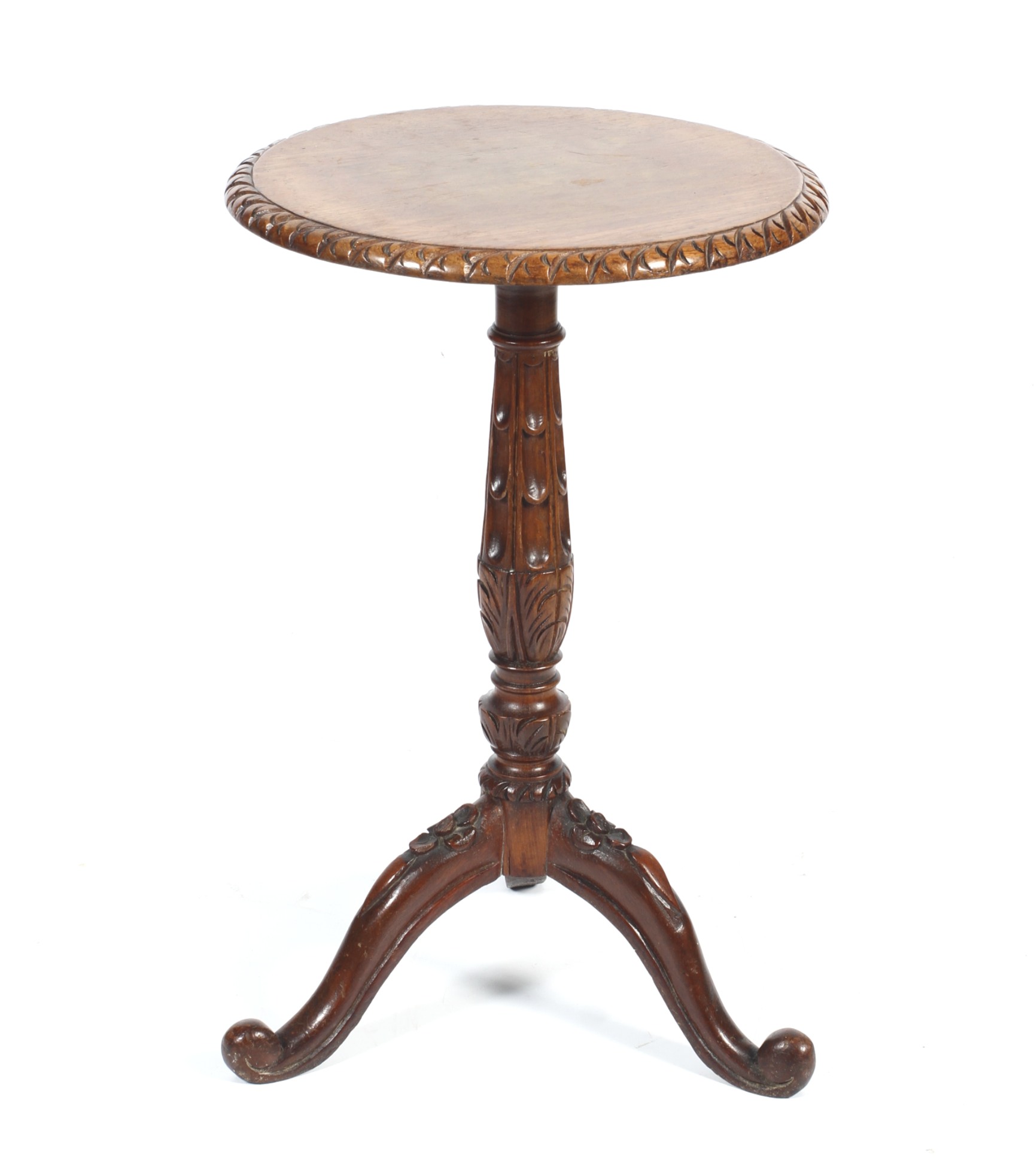 An early 20th century carved oak wine table.