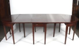 A large mahogany D end dining table.