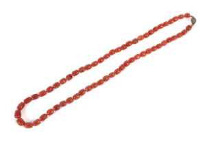 An early 20th century red coral barrel-bead necklace.