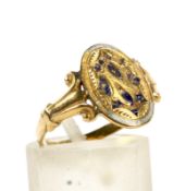 A 19th century gold and enamel oval-panel ring.
