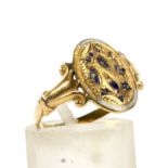 A 19th century gold and enamel oval-panel ring.