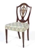 An Edwardian Hepplewhite style mahogany and inlaid shield back dining chair.