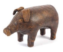 A vintage brown leather footstool modelled as a pig in the Liberty style.