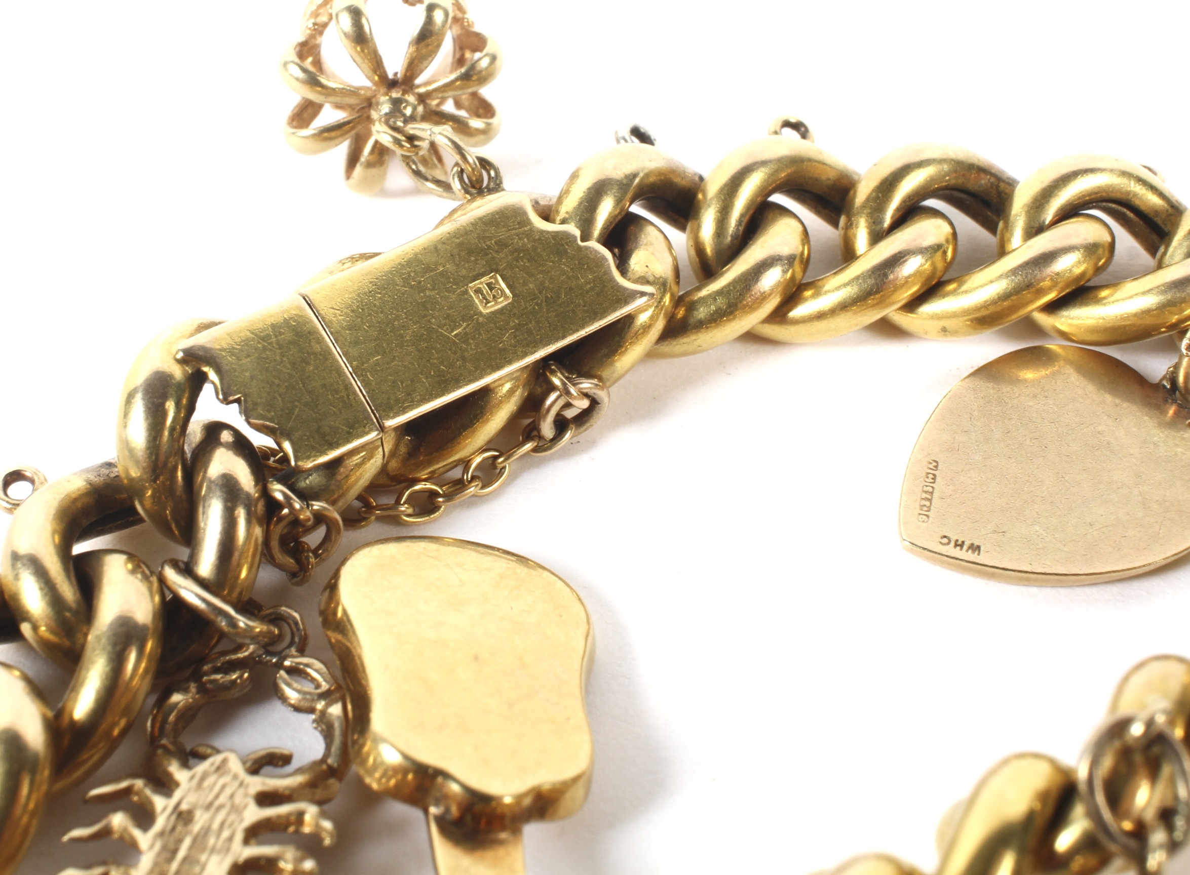 An early 20th century hollow gold charm bracelet. - Image 2 of 2