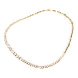 A Continental gold and diamond necklace. The 71 round brilliants graduated approx. 4.5mm-2.