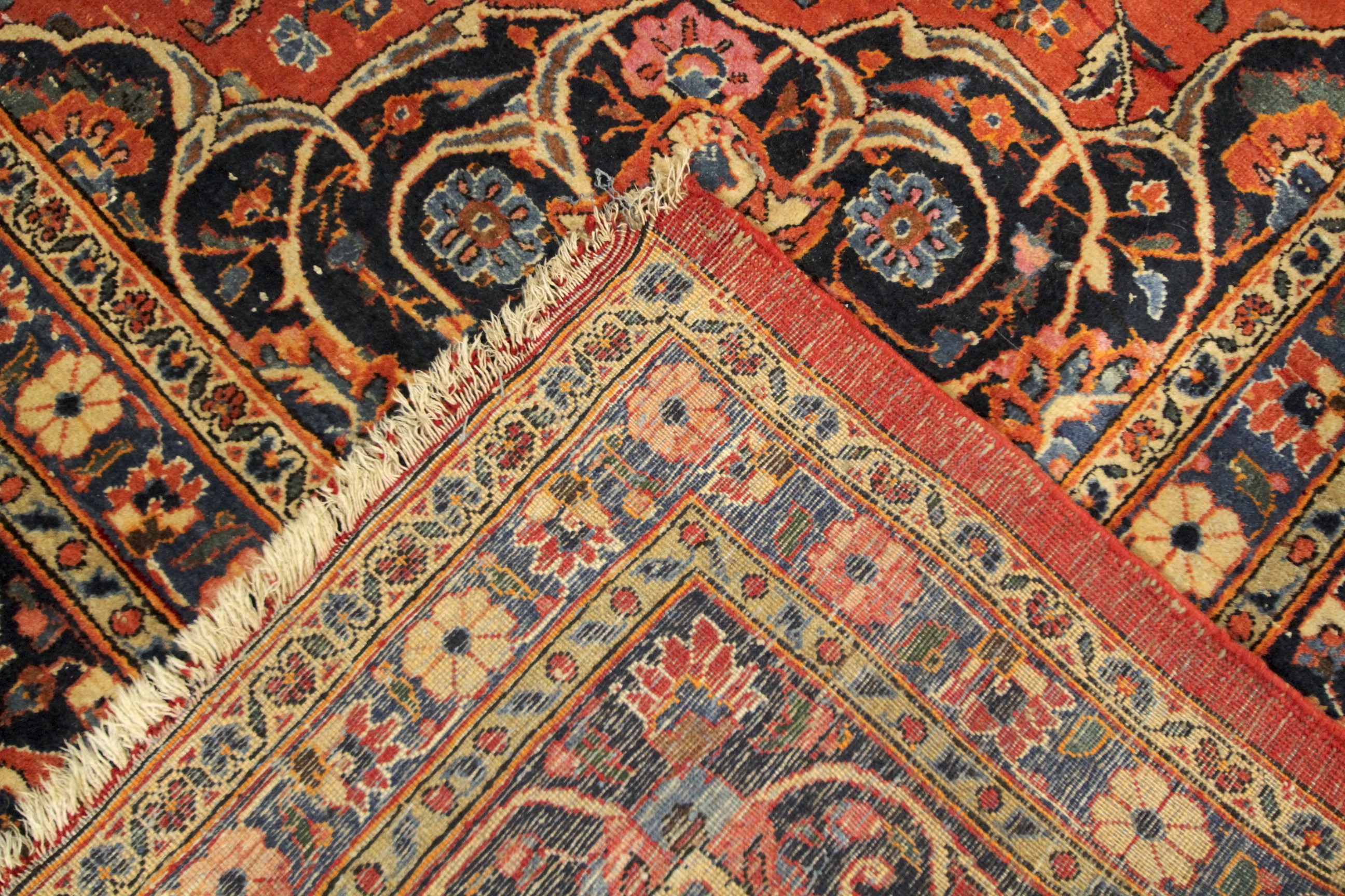 A large Persian style woollen carpet. - Image 3 of 3