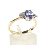 A modern 18ct gold, tanzanite and diamond dress ring.