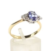 A modern 18ct gold, tanzanite and diamond dress ring.